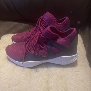 Brand new . Jordan sneakers , purple ish pink , tie up , no box size US 6